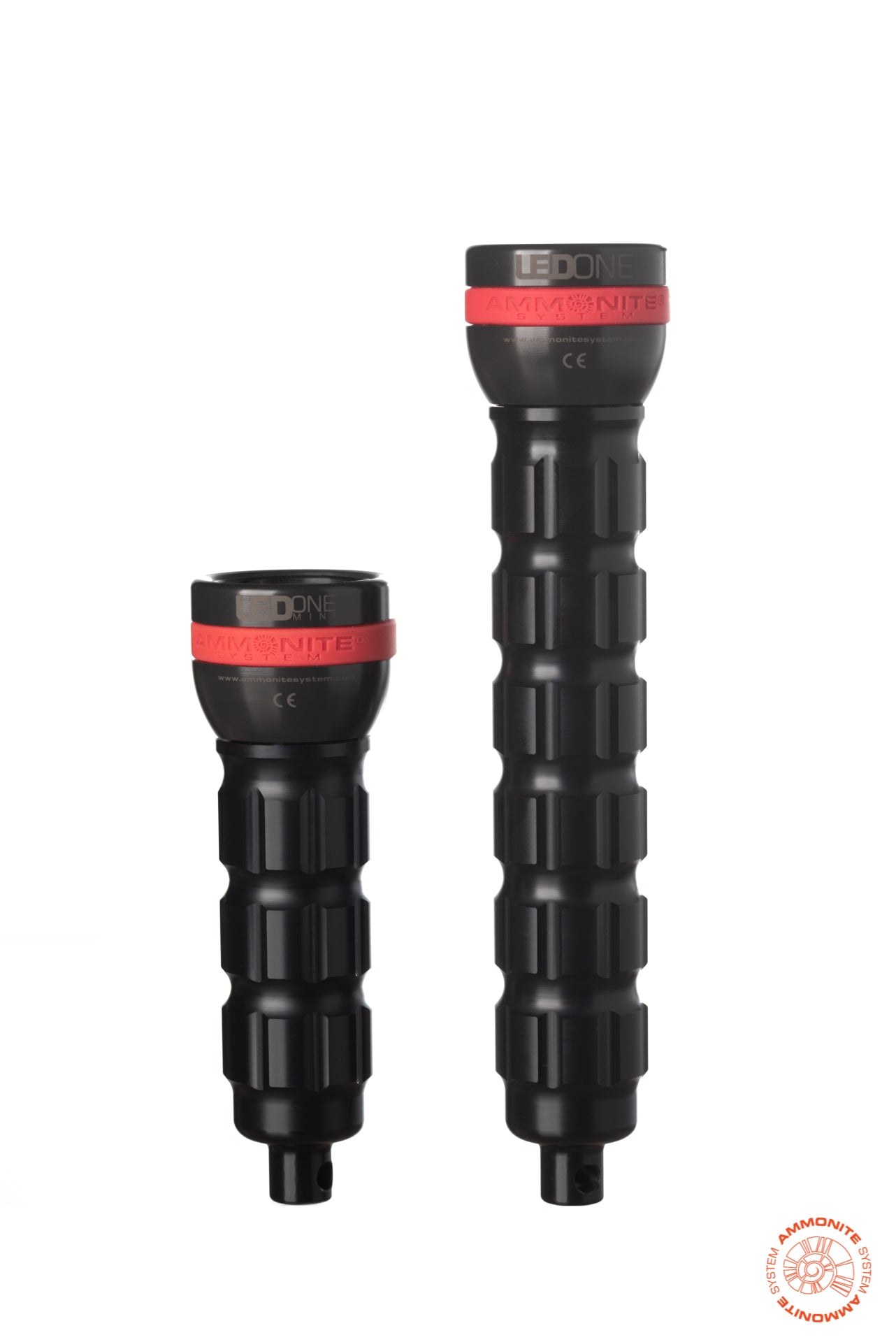 LED ONE MINI & LED ONE backup torches from AMMONITE SYSTEM with a black design and red silicone bands on the top of the torch featuring the AMMONITE SYSTEM logo. 